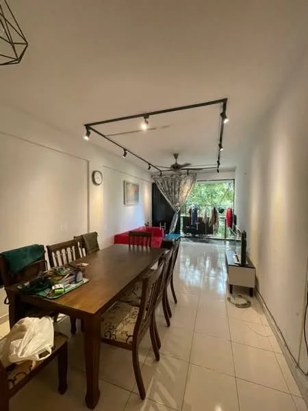 Dining features: wooden dining table, 8 dining chairs, pendant light fixture, white walls, tile flooring, floor-to-ceiling windows, curtains, decorative wall clock, artwork on wall, open view to outdoor area, TV console, sofa in red fabric; style: modern; view: garden.