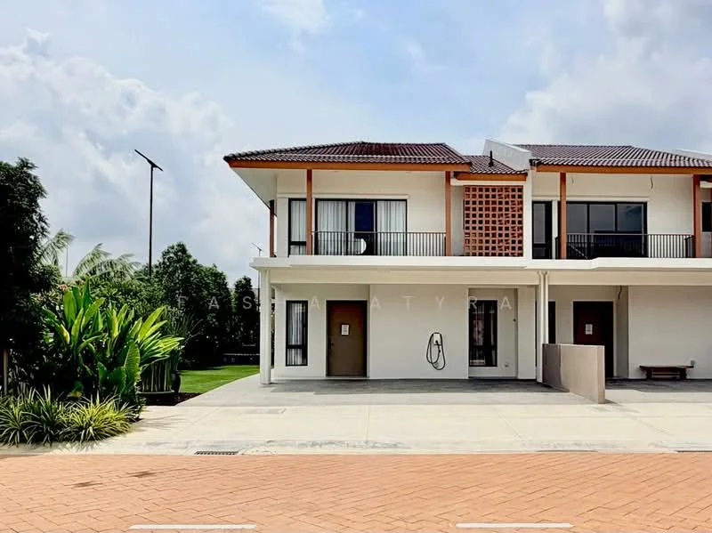 Exterior type: linked terrace house; features: two-storey building, white painted facade, brown tiled roof, recessed balconies, large windows with black frames, front porch area, manicured lawn, paved driveway, landscaped garden, outdoor lighting, surrounded by greenery; style: modern.