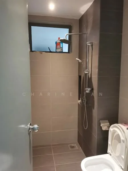 Bathroom features: grey tiled walls, light grey floor tiles, walk-in shower with glass enclosure, rain shower head, handheld shower, chrome basin mixer faucet, one-piece toilet, toilet paper holder, small window, shower drainage, cleaning product on window sill; style: modern.