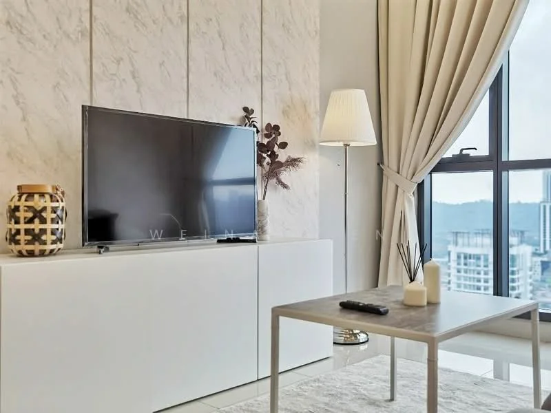 Living features: white cabinetry with sliding doors, marble accent wall, floor-to-ceiling windows, curtains in beige, light-colored area rug, metal coffee table with wooden top, flat-screen TV, decorative vase, table lamp with shade, remote control on coffee table; style: modern; view: city.