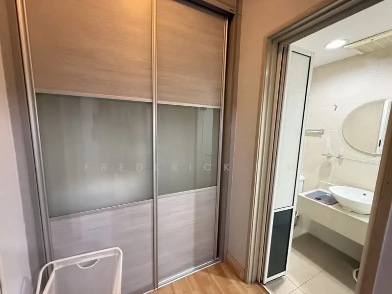 Room features: sliding glass wardrobe with wooden finish, wooden flooring, white painted walls, round mirror, wall-mounted sink, toilet, shower area with glass partition, recessed lighting; style: modern.