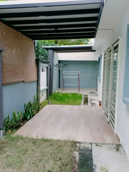 Exterior features: covered walkway with striped roof, grey painted walls, wooden decking, manicured lawn, garden area with plants, clothes drying rack, concrete pathway, sliding glass door, fenced area; style: modern.