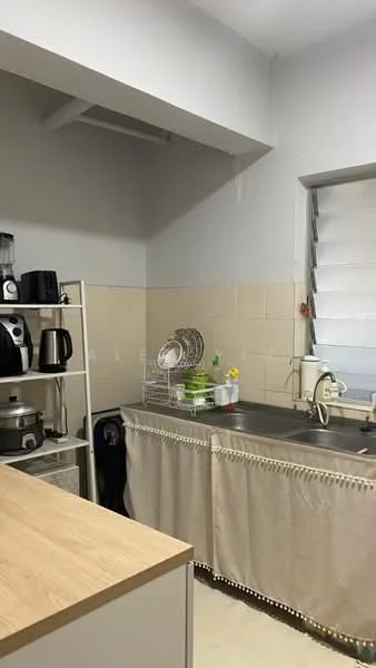 Kitchen features: stainless-steel sink, chrome pull-down faucet, light-colored cabinetry with curtain, countertop with wood finish, white tiled backsplash, kitchen appliances including kettle and rice cooker, open shelving unit, window with horizontal blinds; style: modern.