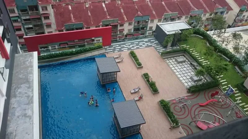 Exterior type: high-rise condominium; features: infinity pool, pool deck with loungers, children's playground, landscaped garden, manicured lawn, paved walkway, water features, recreational area with seating, surrounded by greenery; style: modern.