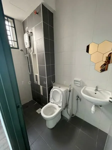 Bathroom features: white toilet, bidet spray, single-sink vanity with wall-mounted faucet, mirror with hexagonal design, shower area with wall-mounted shower head, grey tiled walls, dark grey floor tiles, window for natural light; style: modern.