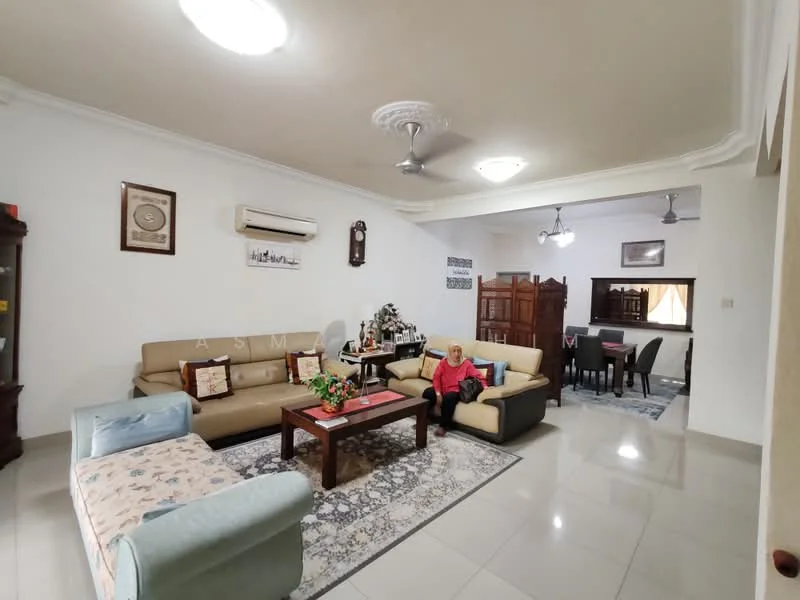 Living features: cream painted walls, white ceiling with decorative moulding, marble tile flooring, 5-blade ceiling fan with light, 2-seater fabric sofa in beige, 3-seater fabric sofa in grey, coffee table with floral arrangement, area rug with geometric pattern, wall-mounted air conditioning unit, framed artwork on walls, wooden side cabinet, dining area visible in background; style: contemporary.