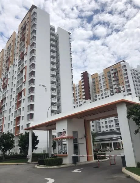 Exterior type: high-rise condominium; features: white painted facade, orange accent panels, glass windows, guard house at entrance, barrier gate, landscaped greenery, surrounded by mature trees, multi-storey building, modern architectural design; style: modern.