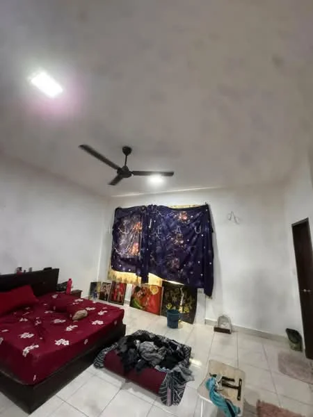 Bedroom features: queen-size bed with red floral bedding, white painted walls, tile flooring, 5-blade ceiling fan with light, curtains with dark blue fabric, decorative wall art, cluttered floor with clothing, small potted plant, door leading to hallway.