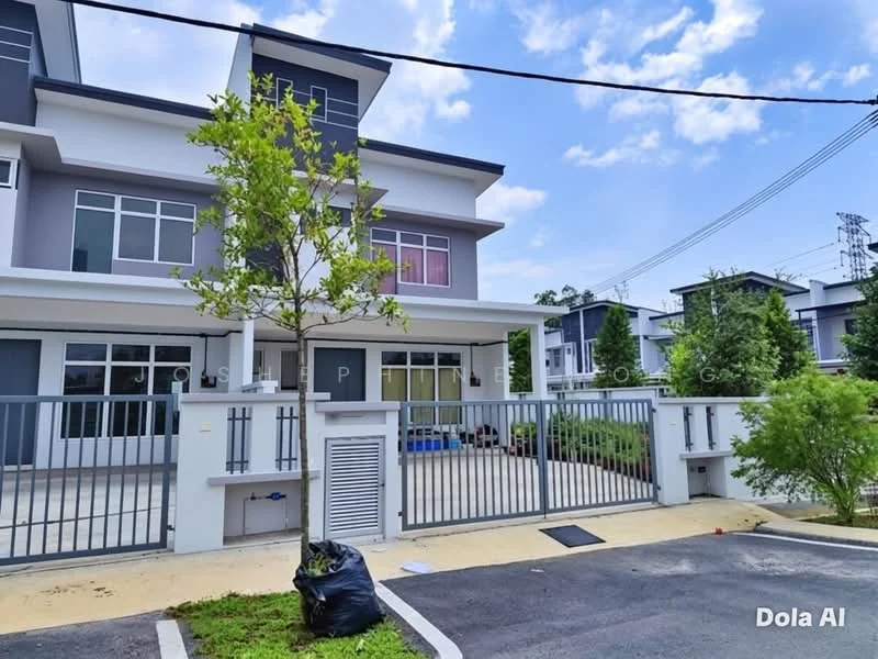 Exterior type: linked terrace house; features: grey and white painted facade, two-storey structure, front garden area, manicured lawn, paved driveway, metal gate, visible parking area, surrounded by greenery, electricity poles in background, blue sky with clouds; style: modern.