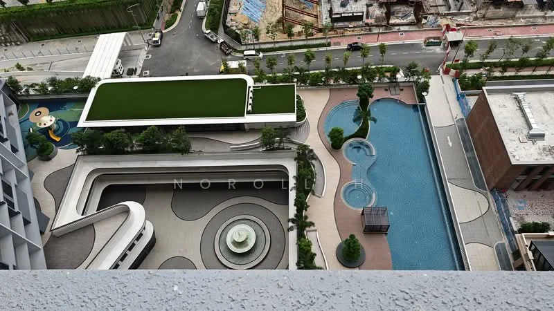 Exterior type: high-rise condominium; features: swimming pool, infinity edge pool, landscape garden, manicured lawn, children's playground, water feature, pool deck with loungers, paved walkways, surrounding greenery, construction site in background; style: modern.