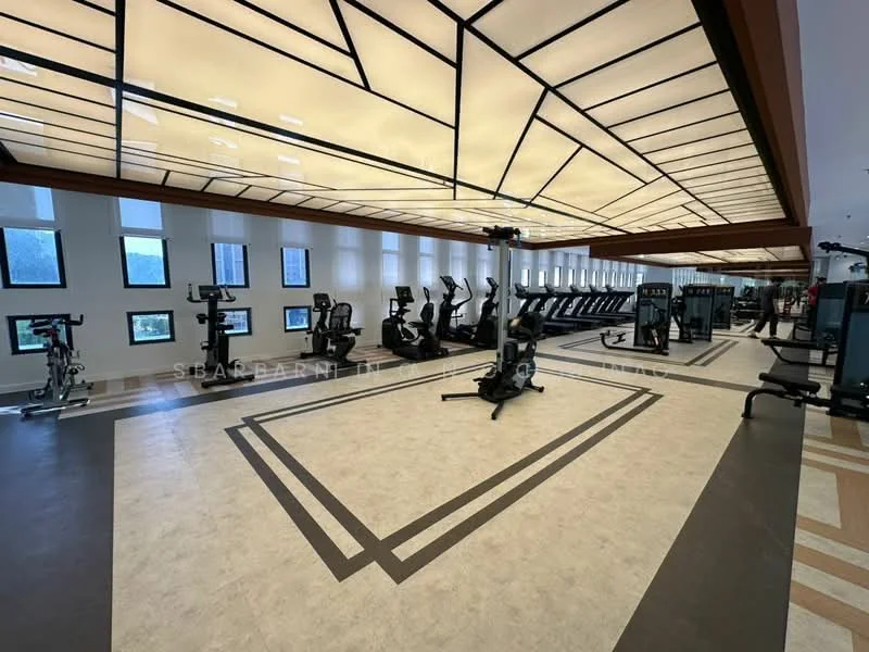 Room features: gym equipment, treadmills, stationary bikes, weight machines, large windows, decorative ceiling with geometric pattern, vinyl flooring, recessed lighting, mirrored walls, open layout; style: modern; view: city.