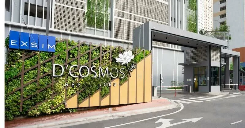 Exterior type: high-rise condominium; features: modern facade with greenery, signage with brand name, covered entrance, landscaped entrance area, paved driveway, glass curtain wall, security gate, intercom panel at entrance; style: modern.