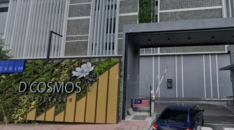 Exterior type: high-rise condominium; features: modern facade with vertical fins, green wall with plants, entrance gate with security access, paved driveway, signage with the name 'D'COSMOS RESIDENCES', visible parking area, surrounded by urban landscape; style: modern.