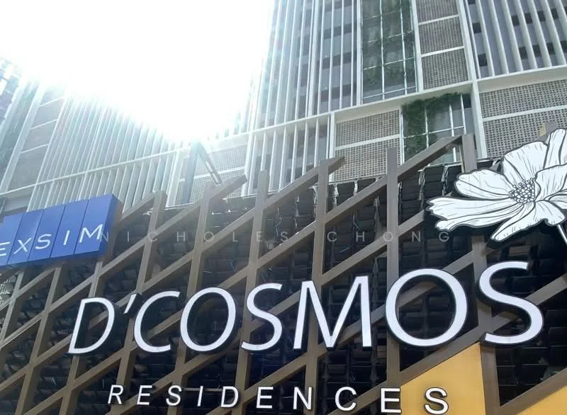 Exterior type: high-rise condominium; features: glass curtain wall, wooden trellis, large signage, decorative flower motif, greenery on facade, modern architectural design; style: contemporary.