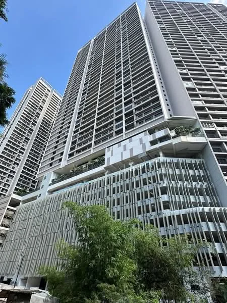 Exterior type: high-rise condominium; features: glass curtain wall, white painted facade, recessed balconies, vertical fins, multiple storeys, landscaped terrace, surrounded by greenery; style: modern.