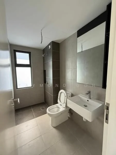 Bathroom features: white wall-mounted sink, chrome basin mixer faucet, large framed mirror, one-piece toilet, grey tiled walls, light grey floor tiles, window for natural light, wall-mounted towel rack; style: modern.