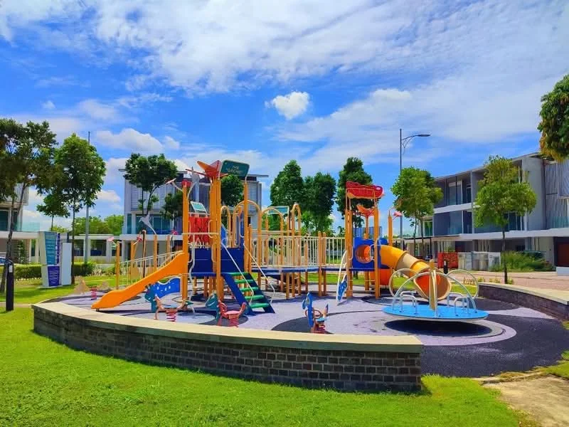 Exterior type: landscape garden; features: children's playground with slides, climbing structures, swing set, colorful play equipment, rubberized safety surface, manicured lawn, mature trees, paved walkway, surrounding residential buildings; style: modern.