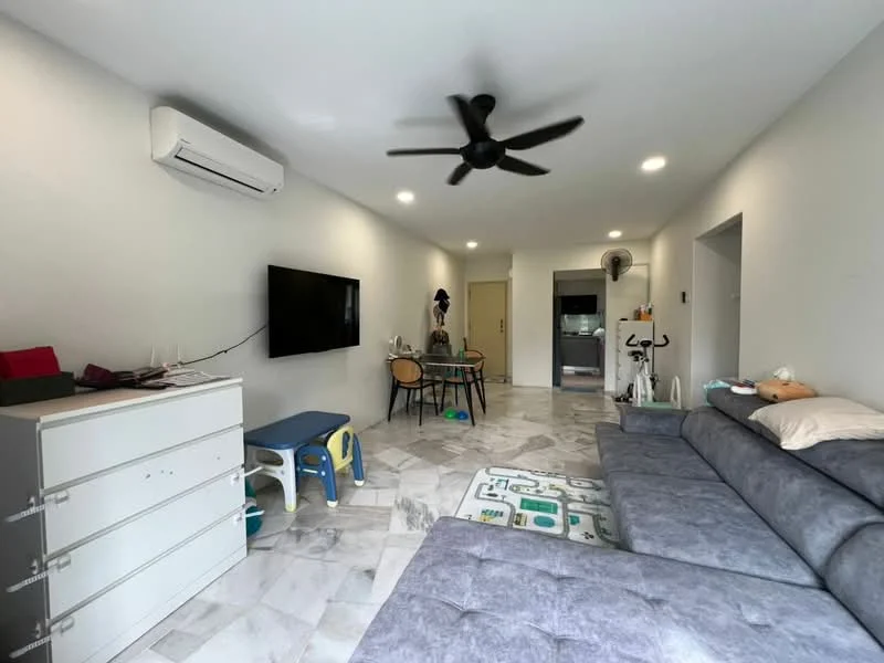 Living features: grey fabric sectional sofa, 3-blade ceiling fan, wall-mounted TV, marble tile flooring, white painted walls, recessed LED downlights, open layout to kitchen, decorative area rug, coffee table, exercise bike, children's play mat, dining table with chairs; style: modern.