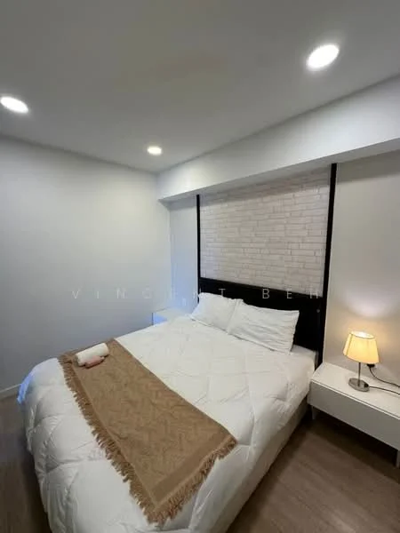 Bedroom features: queen-size bed with white bedding, upholstered headboard, nightstand with lamp, white painted walls, wooden flooring, recessed ceiling lights, brick accent wall behind bed, decorative throw blanket; style: modern.