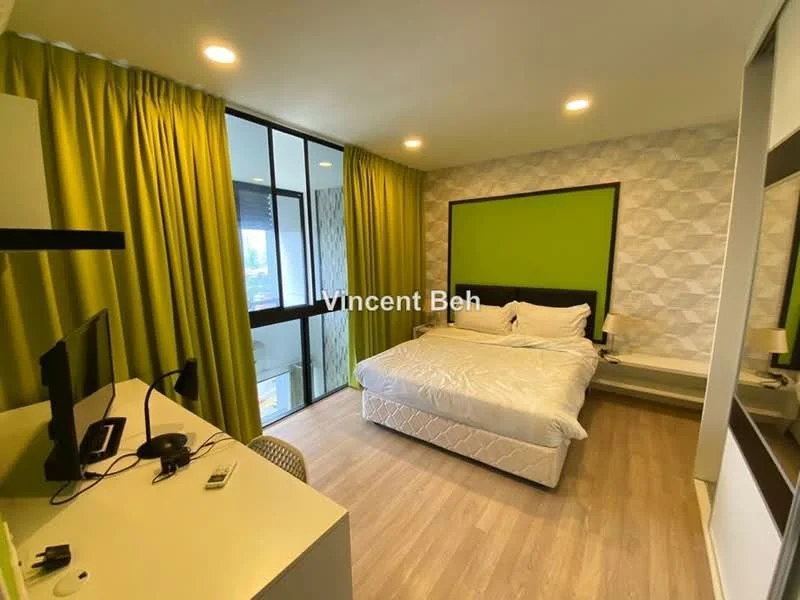 Bedroom features: queen-size bed with white bedding, upholstered headboard, green accent wall, geometric patterned wallpaper, floor-to-ceiling windows, sheer curtains in green, wooden flooring, desk with chair, wall-mounted TV, nightstand, decorative wall light; style: modern; view: city.