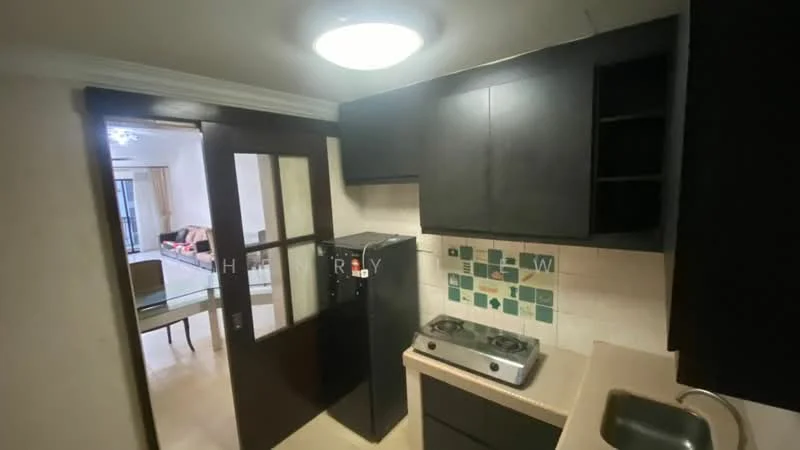 Kitchen features: black cabinetry, stainless-steel fridge, gas stove with 2 burners, beige countertop, tile backsplash with green accents, single-bowl stainless-steel sink, wall-mounted light fixture, cream painted walls, door with glass panels; style: modern.
