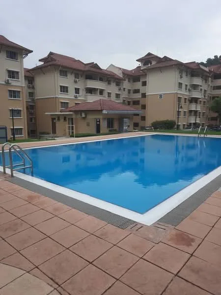 Exterior type: low-rise apartment block; features: swimming pool, pool deck with loungers, surrounded by landscaped garden, multiple storeys, balconies on upper floors, brick facade, sloping tiled roof; style: modern.