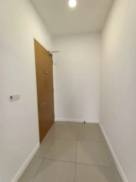 Room features: white painted walls, tile flooring, wooden door, ceiling light; style: modern.