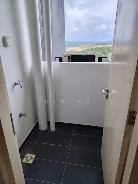 Room features: grey tiled flooring, white painted walls, drainage floor grate, two water outlets, exposed pipes, door leading outside.