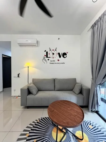 Living features: grey fabric sofa, round wooden coffee table, area rug with geometric pattern, wall-mounted split AC, floor-to-ceiling windows, curtains in light grey, decorative wall art with text, light source from floor lamp; style: modern.