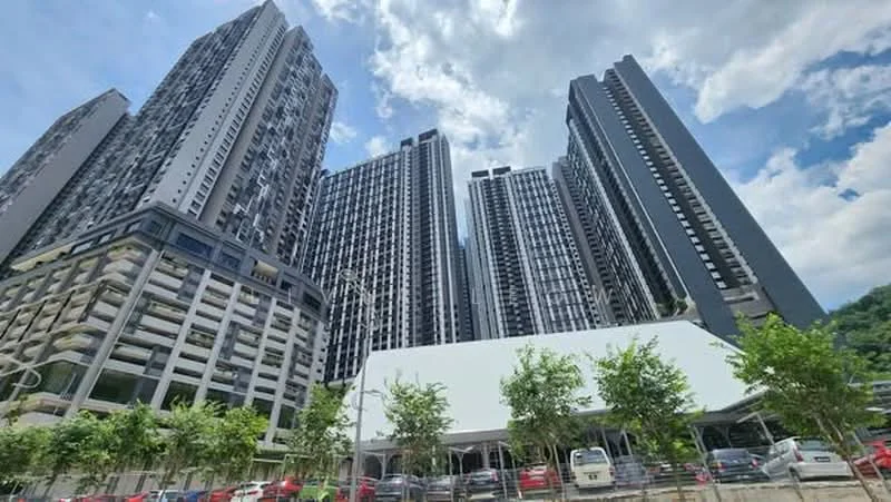 Exterior type: high-rise condominium; features: glass curtain wall, exposed concrete facade, recessed balconies, multi-storey car park, manicured landscaping, surrounded by mature greenery, open-air parking lot; style: modern.