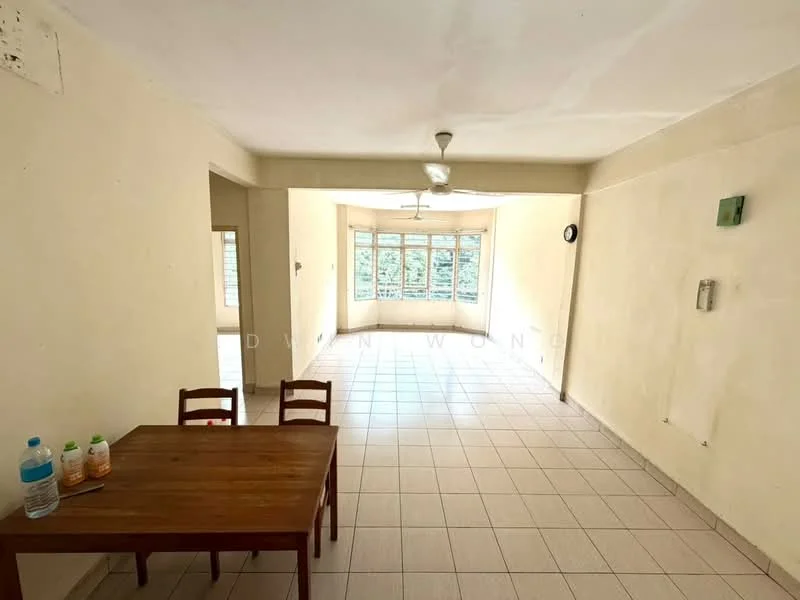 Room features: white painted walls, tiled flooring, ceiling fan, large windows, dining table, wooden chairs, water bottles on table, clock on wall.