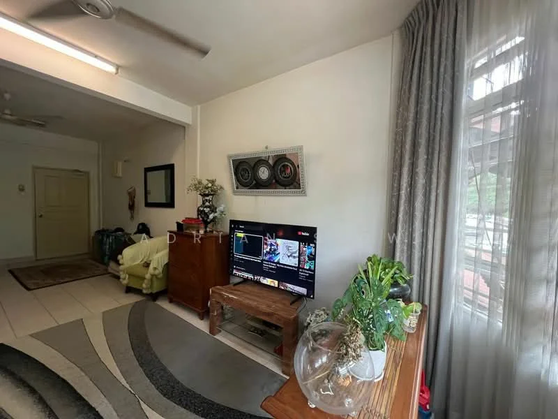 Living features: grey area rug with circular pattern, cream painted walls, white ceiling, 5-blade ceiling fan, wall-mounted TV, wooden TV console, decorative wall art, large window with sheer curtains, potted houseplants, wooden side table, light-colored tiled flooring; style: modern; view: garden.