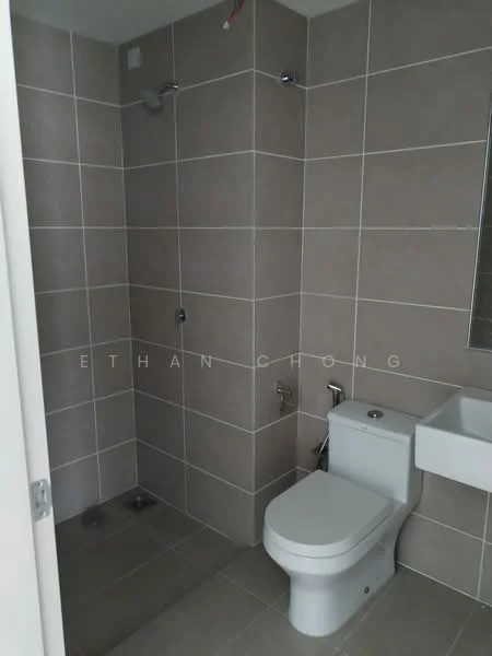 Bathroom features: grey tiled walls, light grey floor tiles, walk-in shower with glass partition, chrome shower head, chrome wall-mounted faucet, white sink with wall-mounted faucet, one-piece toilet, mirror above sink; style: modern.