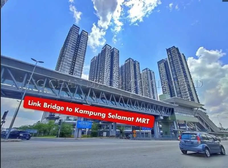 Exterior type: high-rise condominium; features: glass curtain wall, multiple storeys, link bridge to MRT station, modern architectural design, surrounded by urban landscape, parking area visible, signage for MRT access; style: modern.