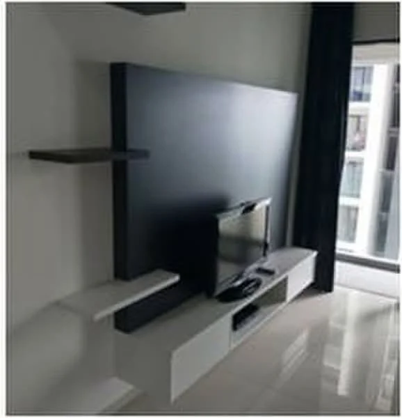 Living features: white glossy wall-mounted TV console, black accent wall behind TV, floating shelves in dark wood, large window with sheer curtains, glossy tile flooring, recessed lighting, neutral wall color, modern design; style: modern.