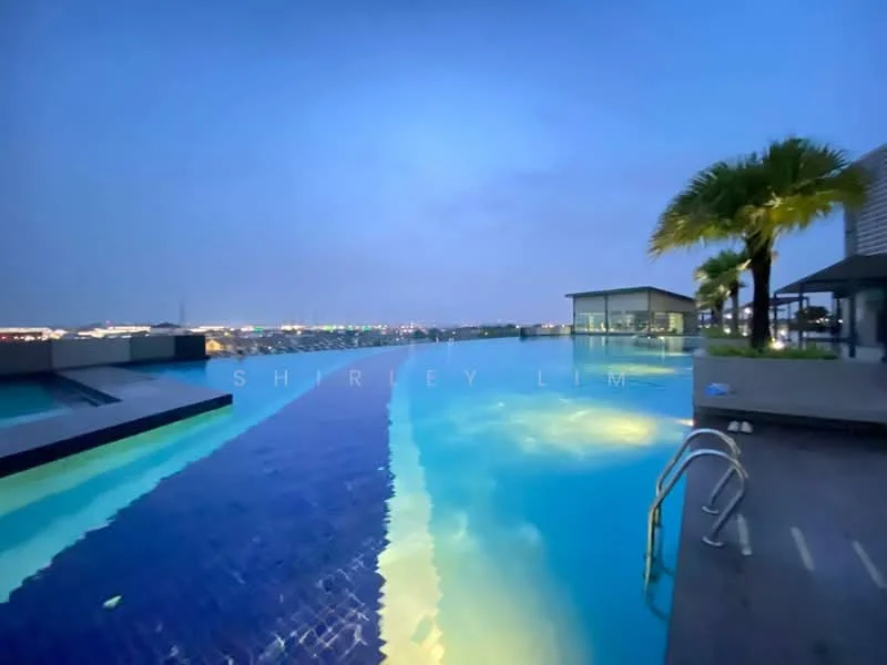 Exterior type: swimming pool deck; features: infinity pool, pool deck with loungers, landscaping with palm trees, night lighting, city skyline view, water feature, glass railing; style: modern.