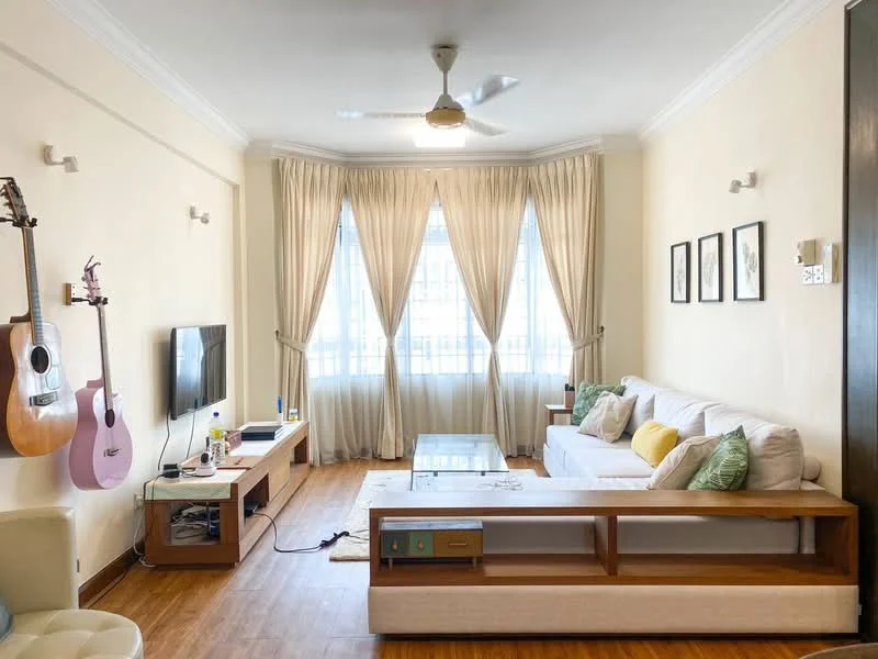 Living features: 3-seater fabric sofa in white, wooden coffee table, TV console, wall-mounted TV, ceiling fan with light, wooden feature wall, large windows with sheer curtains, decorative wall art, laminate flooring, green decorative cushions, acoustic guitar, pink guitar, area rug; style: modern; view: city.