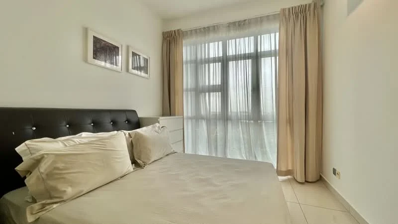 Bedroom features: queen-size bed, upholstered headboard, white bedding, two bedside pillows, white curtains, floor-to-ceiling windows, light-colored walls, tile flooring, framed artwork on walls, built-in wardrobe; style: modern.