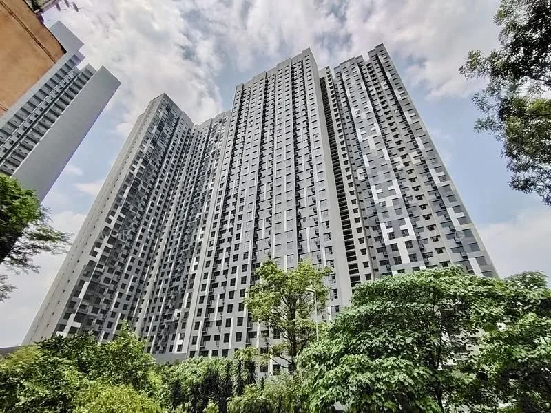 Exterior type: high-rise condominium; features: glass curtain wall, grey painted facade, recessed balconies, vertical fins, surrounded by mature greenery, multiple storeys, urban context; style: modern.
