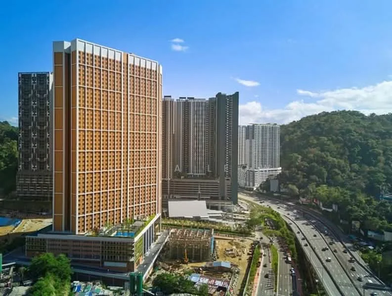 Exterior type: high-rise condominium; features: orange and grey facade, glass curtain wall, surrounded by greenery, multiple high-rise buildings, road access in front, construction site visible, urban context with highway, varied architectural styles; style: modern.