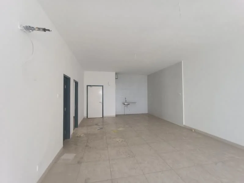 Room features: white painted walls, grey tiled flooring, single-bowl sink, wall-mounted faucet, two doors visible, one wall with no features, ceiling with no visible fixtures.