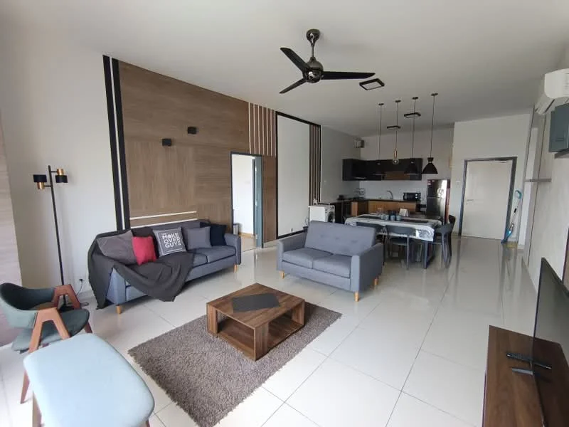 Living features: grey fabric 3-seater sofa, grey fabric 2-seater sofa, black coffee table, area rug with geometric pattern, wall-mounted TV, wooden TV console, 5-blade ceiling fan with light, recessed downlights, decorative wall paneling, white painted walls, large windows, dining table with chairs, open-plan layout; style: modern. Kitchen features: black cabinetry, stainless-steel sink, built-in oven, freestanding range oven, microwave, refrigerator, countertop with bar stools, tile backsplash; style: modern.