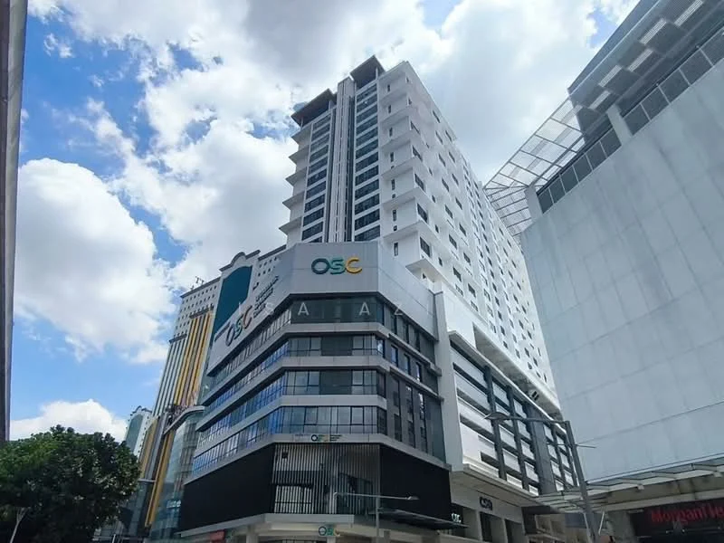 Exterior type: high-rise condominium; features: glass curtain wall, white painted facade, projecting balconies, signage on building, multiple storeys, surrounded by urban landscape, adjacent to commercial buildings; style: modern.