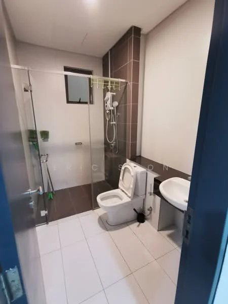Bathroom features: white tiled walls, dark brown accent wall, glass shower enclosure, rain shower head, handheld shower, toilet, single-sink vanity, white sink, chrome basin mixer, mirror, white tiled flooring, shower caddy, towel rack; style: modern.