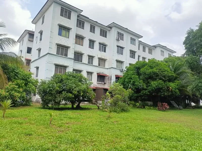 Exterior type: low-rise apartment block; features: white painted facade, 3-storey low-rise, green lawn, mature trees, balconies on upper floors, windows with grills, surrounded by greenery; style: modern.