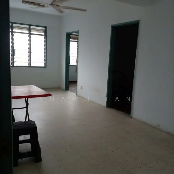 Room features: white painted walls, light-colored flooring, ceiling fan, two windows with horizontal slats, doorway leading to another room, doorway leading to another room, table with red surface, black stool; style: minimalist.