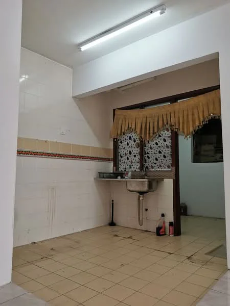 Kitchen features: white tiled walls, cream tiled backsplash, grey ceramic floor tiles, single-bowl stainless-steel sink, chrome faucet, window with decorative curtain, wall-mounted fluorescent lighting, kitchen countertop, open space layout.