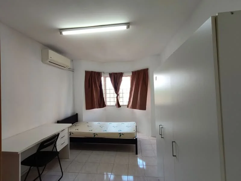Bedroom features: white painted walls, tile flooring, 1 wall-mounted split AC, 2 brown curtain panels, single bed with mattress, study desk with drawer, black chair, built-in wardrobe with sliding doors, window with grid, ceiling light fixture; style: minimalist.