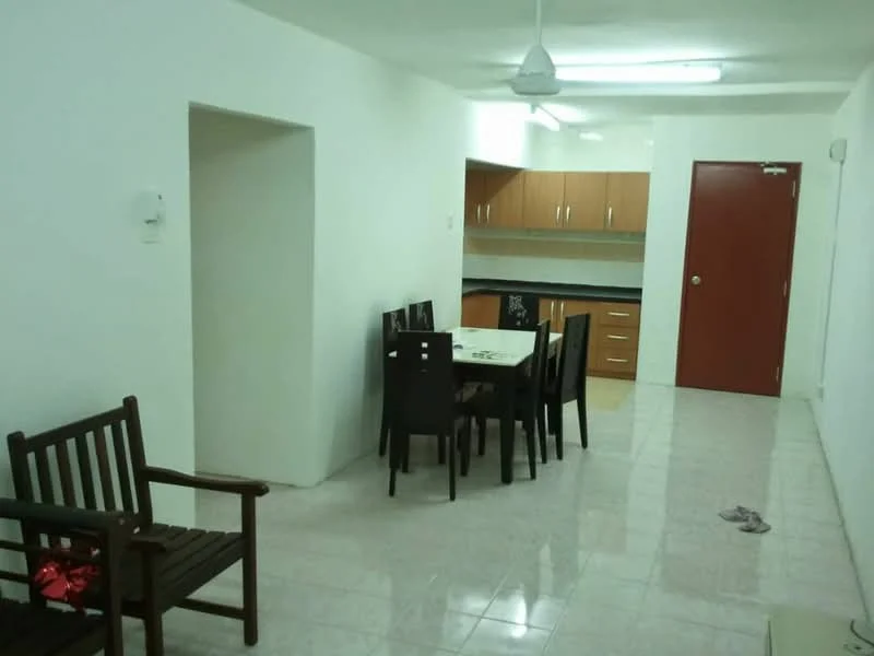 Living features: white painted walls, glossy tile flooring, ceiling fan, dining table with chairs, wooden bench, kitchen cabinetry with brown finish, black countertop, refrigerator, door leading to hallway.