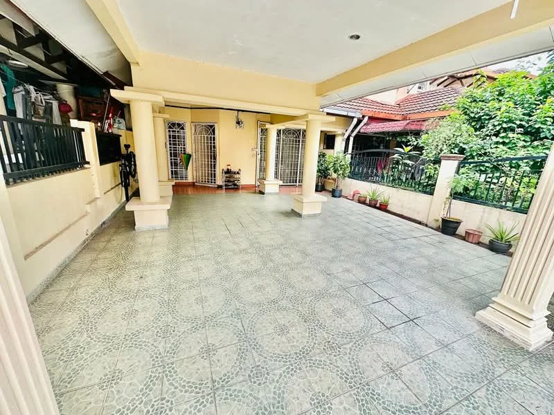 Exterior type: detached bungalow; features: covered porch, tiled flooring, columns supporting the roof, garden area with potted plants, fenced perimeter, access to main entrance, open space for outdoor activities, surrounded by greenery; style: modern.